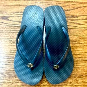 Like new! Tory Burch wedge flip flops in black. Size 6.